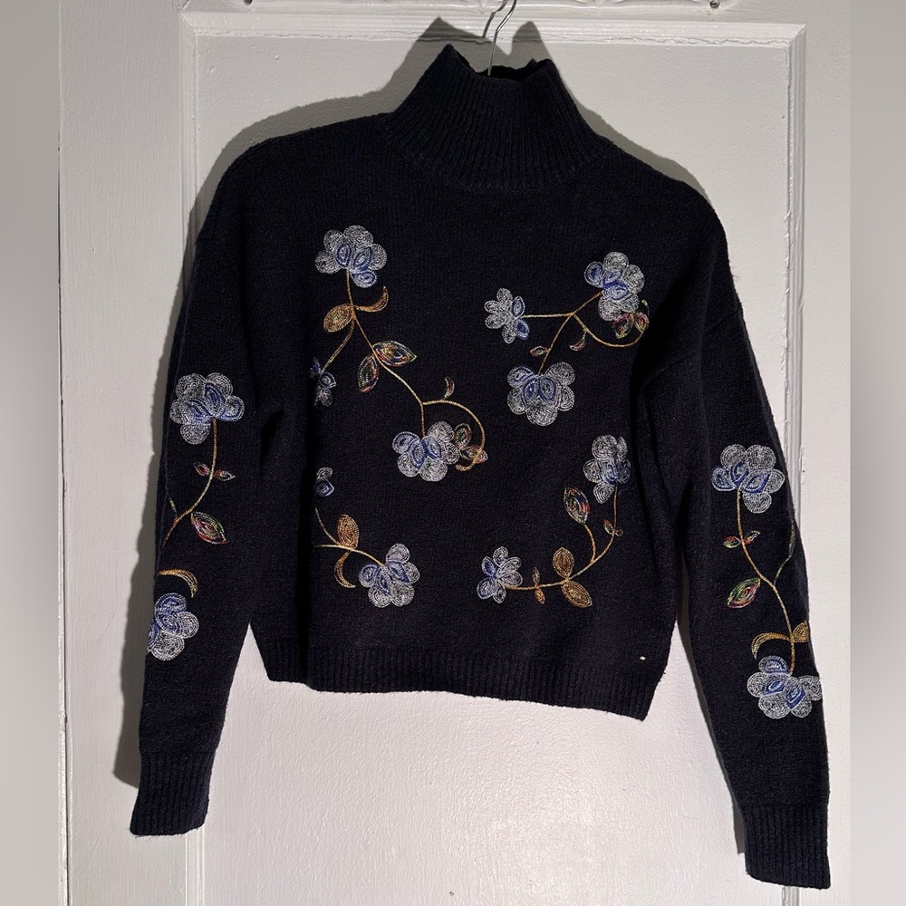 Franchesca’s navy floral mock neck sweater. Size M